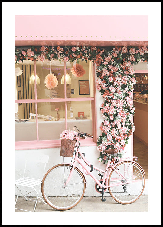 Una bicicleta rosa en flor Póster