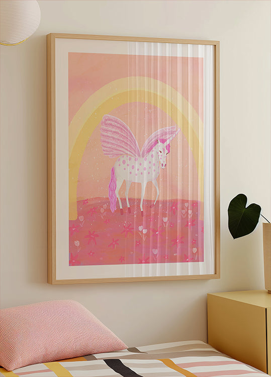 un póster enmarcado de un unicornio con una combinación de colores rosa y blanco, sobre un fondo rosa y amarillo con un arco de arcoíris.