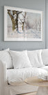 a living room with a white couch and a coffee table