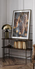 a picture of a pine cone hanging on a wall