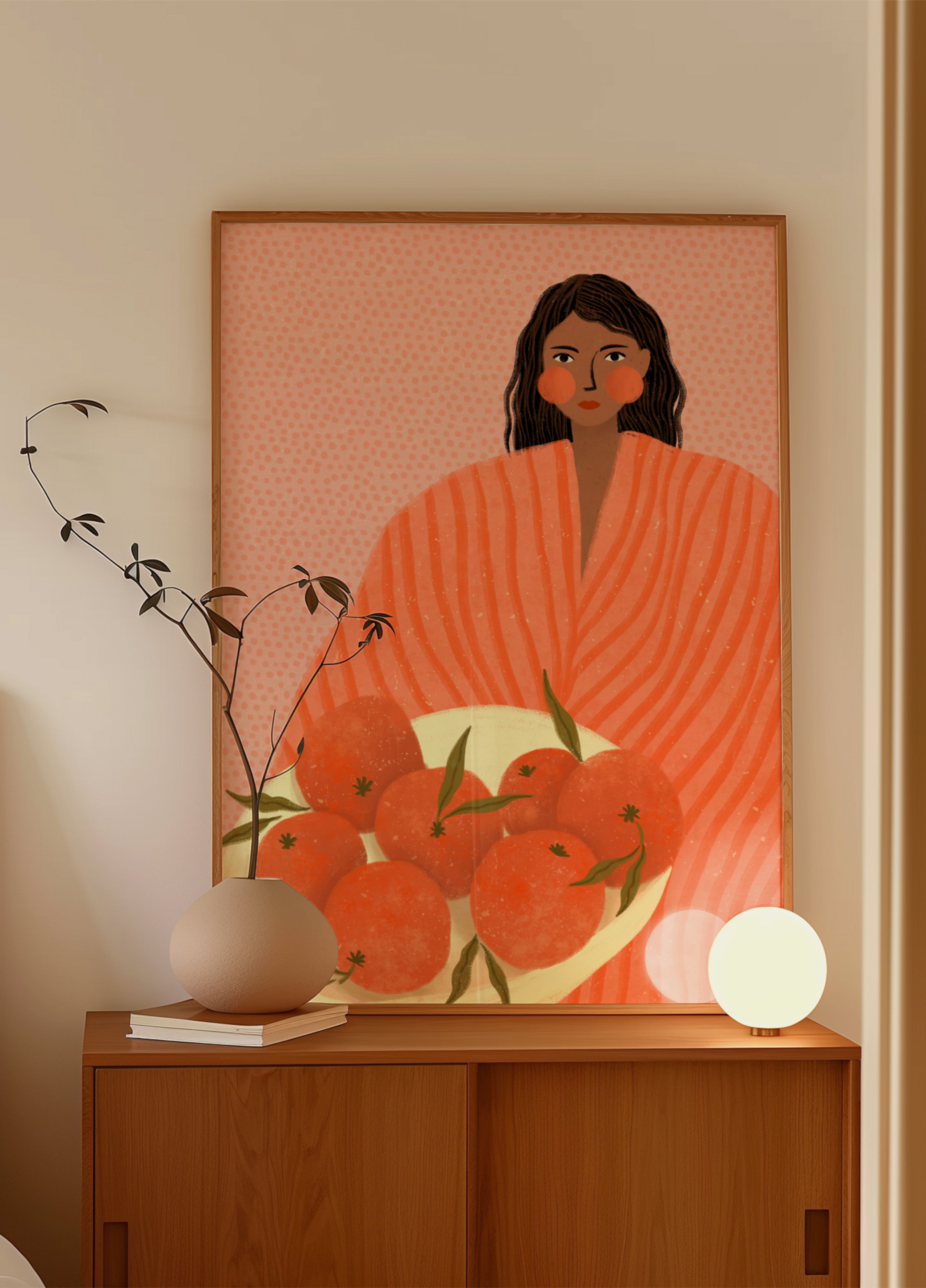 Mujer sosteniendo naranjas